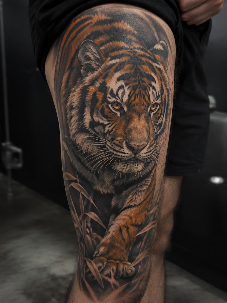 Stalking Tiger — animals tattoo on the thigh